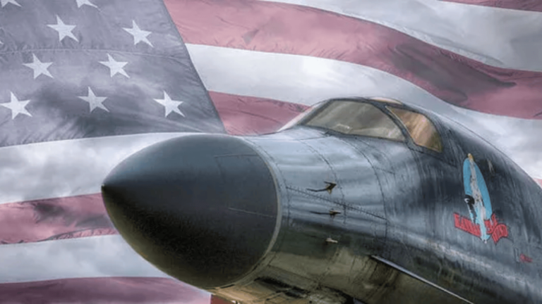 fighter jet in front of American flag